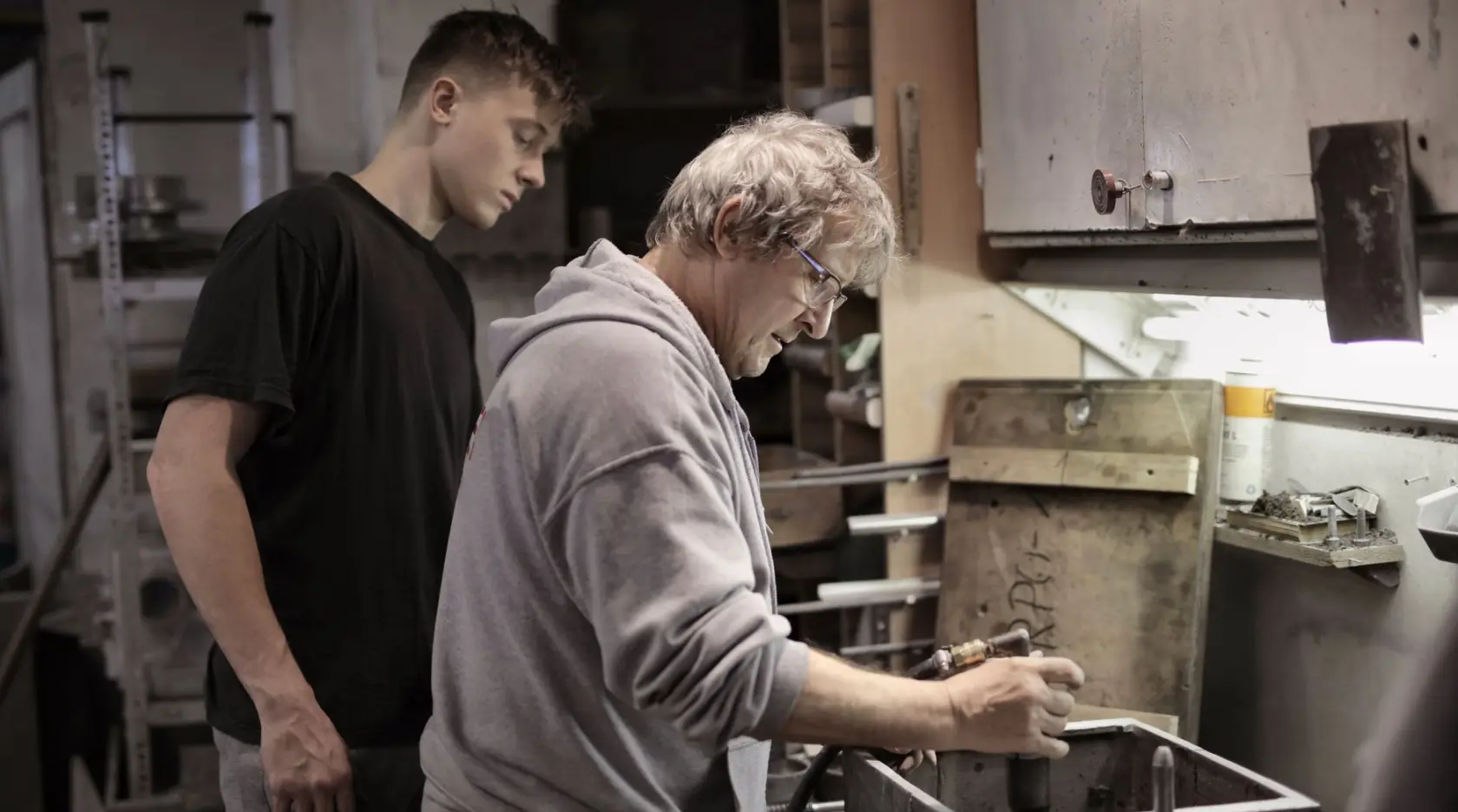 An experienced tradesperson mentoring an apprentice