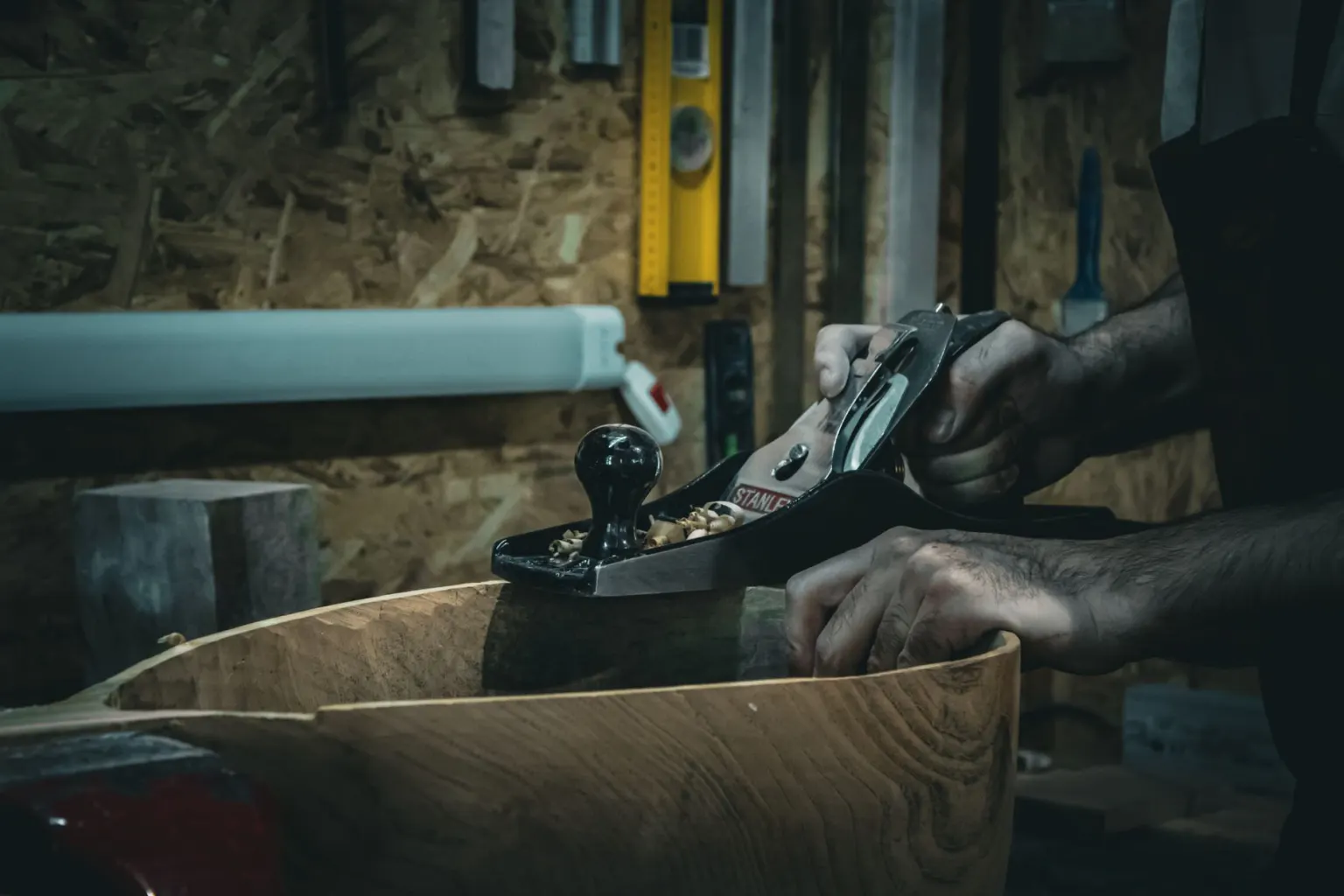 Joiner smoothing timber with a hand plane